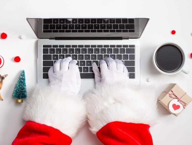 Holiday online shopping theme with laptop stock photo